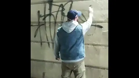 graffiti tag in a jean vest